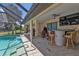 Enjoy outdoor dining and entertaining by the pool at 2208 Barksdale St, Port Charlotte, FL 33948
