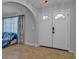 Bright entryway with double doors and tile flooring at 2208 Barksdale St, Port Charlotte, FL 33948