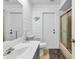 Clean bathroom with walk-in shower and updated vanity at 2208 Barksdale St, Port Charlotte, FL 33948