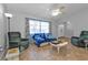 Living room with ample natural light and ceiling fan at 2208 Barksdale St, Port Charlotte, FL 33948