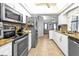 Updated kitchen featuring stainless steel appliances and granite countertops at 2208 Barksdale St, Port Charlotte, FL 33948