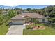 Single-story house with a spacious yard and driveway at 2208 Barksdale St, Port Charlotte, FL 33948