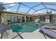 Relaxing screened pool and spa with ample lounge space at 2208 Barksdale St, Port Charlotte, FL 33948