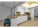 Kitchen with granite countertops, stainless steel appliances, and breakfast bar at 2208 Barksdale St, Port Charlotte, FL 33948
