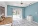Bedroom with tiled floors, sliding glass doors opening to the pool, and a daybed at 2208 Barksdale St, Port Charlotte, FL 33948