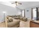 Comfortable living room with sectional sofa and large windows at 2208 Barksdale St, Port Charlotte, FL 33948