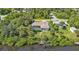Aerial view showcasing house, pool, dock and canal access at 2208 Barksdale St, Port Charlotte, FL 33948