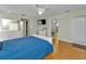 Spacious bedroom with wood flooring, ceiling fan and access to the bathroom at 2208 Barksdale St, Port Charlotte, FL 33948