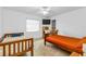 Two beds and ceiling fan in this well-lit bedroom at 2208 Barksdale St, Port Charlotte, FL 33948