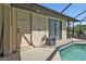 Poolside view showcasing a storage area and pool access at 2208 Barksdale St, Port Charlotte, FL 33948