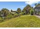 Spacious backyard with lush grass, offering a private oasis at 2208 Barksdale St, Port Charlotte, FL 33948