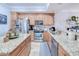 Spacious kitchen with granite countertops and island at 3228 Purple Martin Dr # 113, Punta Gorda, FL 33950