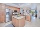 Modern kitchen with stainless steel appliances and an island at 3228 Purple Martin Dr # 113, Punta Gorda, FL 33950