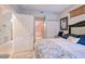 Primary bedroom with white dresser and access to the bathroom at 3228 Purple Martin Dr # 113, Punta Gorda, FL 33950