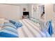 Bedroom with blue and white striped bedding at 3228 Purple Martin Dr # 113, Punta Gorda, FL 33950
