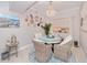 Bright dining area with a round table and wicker chairs at 3228 Purple Martin Dr # 113, Punta Gorda, FL 33950