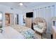 Bedroom with floral bedding, wicker chair, and dresser at 3228 Purple Martin Dr # 113, Punta Gorda, FL 33950