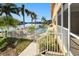 Community pool with water access and lush landscaping at 3228 Purple Martin Dr # 113, Punta Gorda, FL 33950