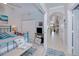 Bedroom with teal metal bed frame, striped bedding, and view of hallway at 3228 Purple Martin Dr # 113, Punta Gorda, FL 33950