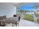 Enjoy waterfront views from this lanai, complete with a table and chairs at 3228 Purple Martin Dr # 113, Punta Gorda, FL 33950