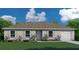 One-story house with a light brown roof and a two-car garage at 1378 Arundel Ave, North Port, FL 34288