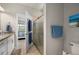 Bathroom with shower, toilet and a view into bedroom at 2524 Daisy Dr, North Port, FL 34289