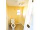 Small bathroom with toilet and a window at 8362 Osprey Rd, Englewood, FL 34224