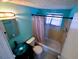 Clean bathroom with tub shower and updated vanity at 8362 Osprey Rd, Englewood, FL 34224