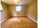 Bedroom with tile floors, window, and ceiling fan at 8362 Osprey Rd, Englewood, FL 34224