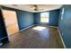 Bedroom with gray tile flooring and blue walls at 8362 Osprey Rd, Englewood, FL 34224