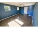 Bedroom with tile floors, ceiling fan, and two windows at 8362 Osprey Rd, Englewood, FL 34224