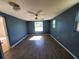 Bright bedroom with gray tile flooring and blue walls at 8362 Osprey Rd, Englewood, FL 34224
