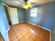 Bedroom with tile floors and a ceiling fan at 8362 Osprey Rd, Englewood, FL 34224
