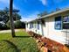 Side view of a house with landscaping, showcasing curb appeal at 8362 Osprey Rd, Englewood, FL 34224