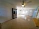 Open living area with tile floors and a ceiling fan at 8362 Osprey Rd, Englewood, FL 34224