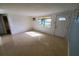 Spacious living room with tile flooring and large window at 8362 Osprey Rd, Englewood, FL 34224