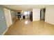 Spacious living room with tile floors and a ceiling fan at 8362 Osprey Rd, Englewood, FL 34224