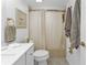 Updated bathroom with white vanity and tub shower at 1352 Rock Dove Ct # B204, Punta Gorda, FL 33950