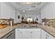 Modern kitchen features granite countertops and a breakfast bar at 1352 Rock Dove Ct # B204, Punta Gorda, FL 33950