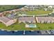 Aerial view of canal front community featuring a pool and parking at 1352 Rock Dove Ct # B204, Punta Gorda, FL 33950