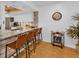 Kitchen with breakfast bar and woven leather barstools at 1352 Rock Dove Ct # B204, Punta Gorda, FL 33950
