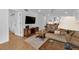 Living room with hardwood floors and flat screen TV at 1352 Rock Dove Ct # B204, Punta Gorda, FL 33950