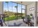 Relaxing screened porch with outdoor furniture at 7607 Grand Estuary Trl # 104, Bradenton, FL 34212