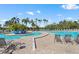 Resort-style pool with lounge chairs and landscaping at 7607 Grand Estuary Trl # 104, Bradenton, FL 34212