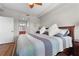 Spacious bedroom with king-size bed and en-suite bathroom access at 7607 Grand Estuary Trl # 104, Bradenton, FL 34212