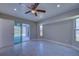 Bedroom with pool view, sliding glass door and ceiling fan at 7379 Snow Dr, Englewood, FL 34224