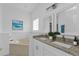 Spa-like bathroom with a large soaking tub and double vanity at 24083 Buckingham Way, Port Charlotte, FL 33980