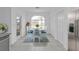 Bright dining area with table, chairs, and access to the back patio at 24083 Buckingham Way, Port Charlotte, FL 33980