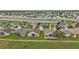 Aerial view showcasing the property's location within a golf course community at 24083 Buckingham Way, Port Charlotte, FL 33980