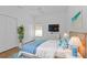 Comfortable guest bedroom with a queen-size bed and ample closet space at 24083 Buckingham Way, Port Charlotte, FL 33980